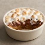 Deep dish s mores bowl with graham crust, melted chocolate, and toasted mini marshmallows