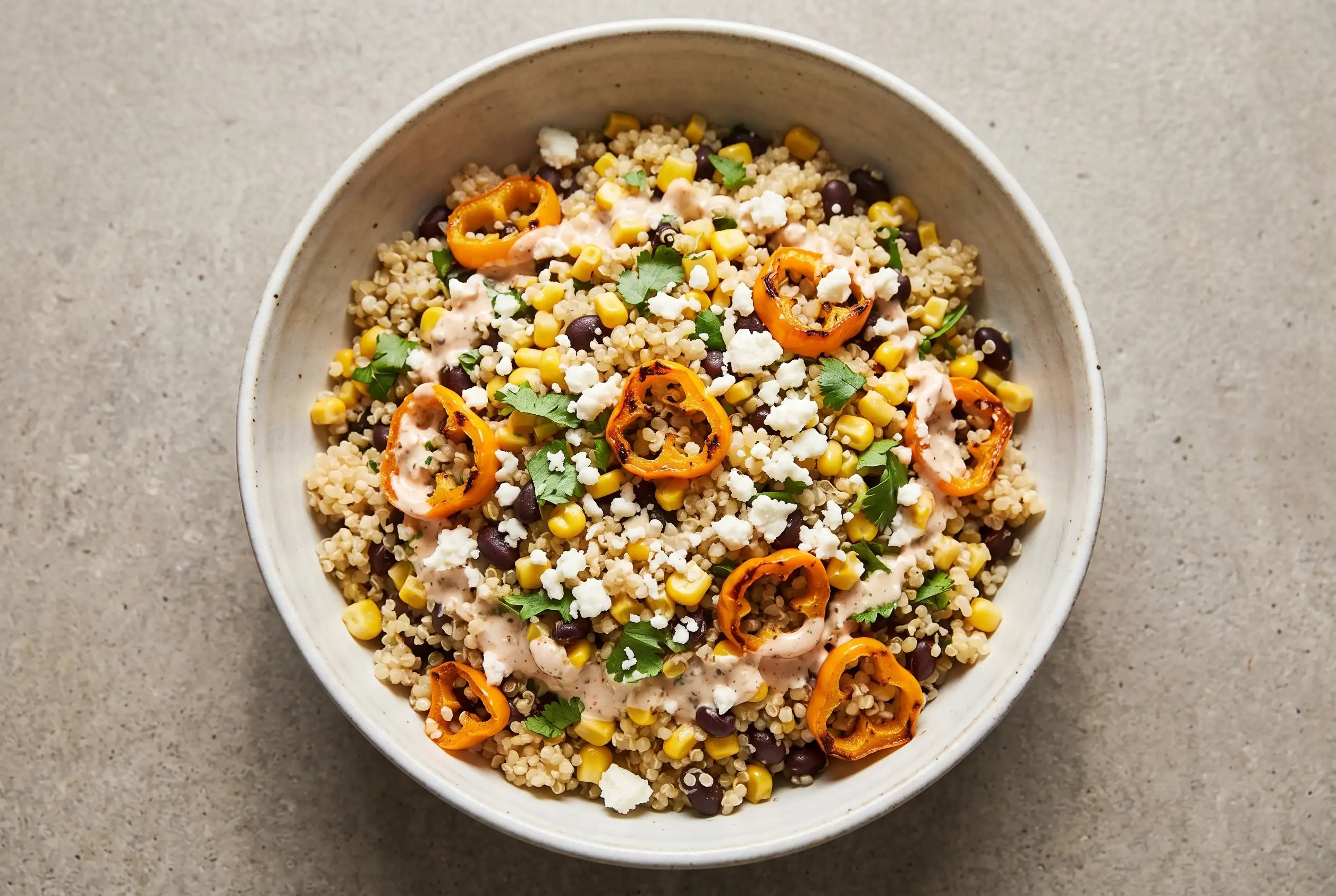 Elote Quinoa Salad Bowl Elote quinoa salad with corn, black beans, quinoa, peppers, cotija cheese, and chile-lime dressing