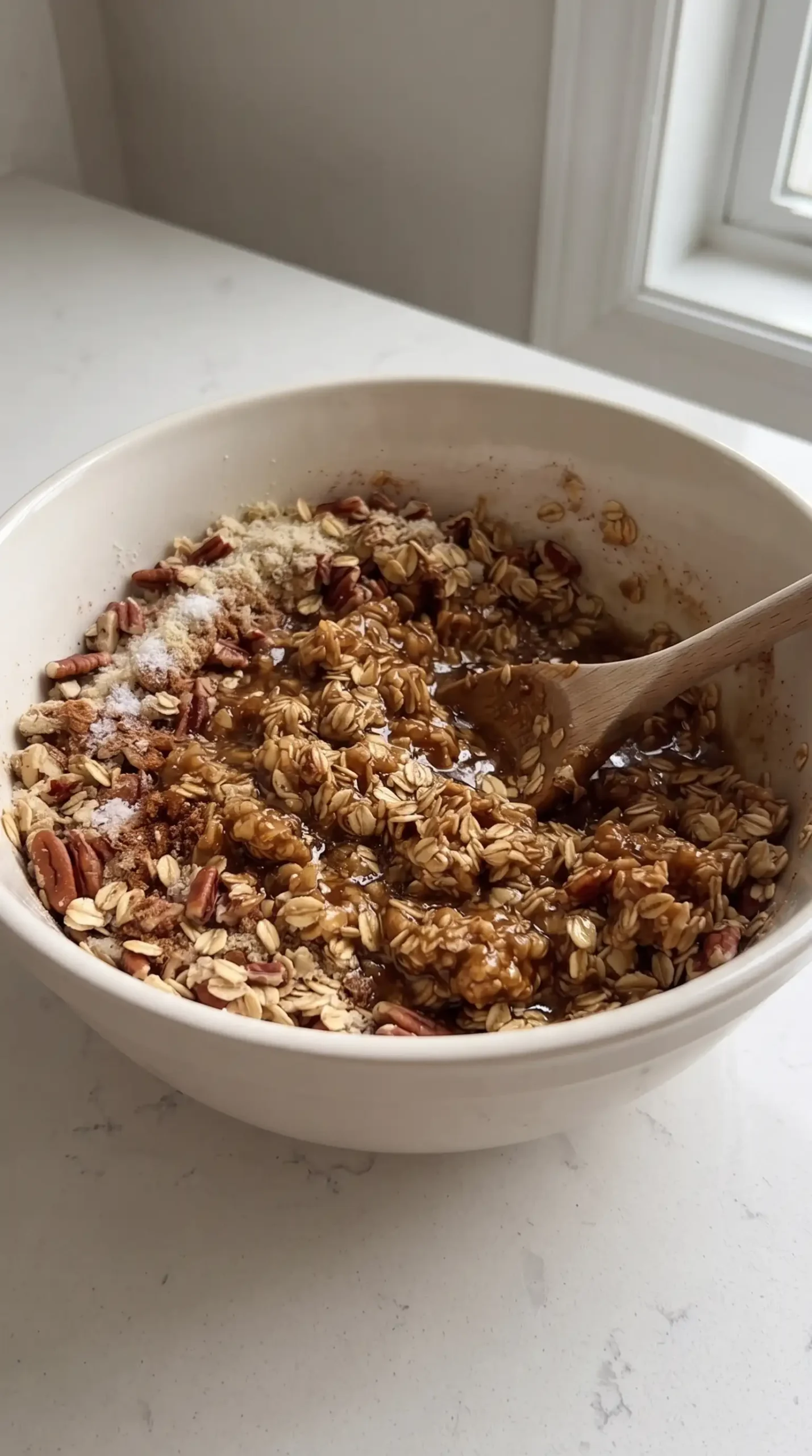 Oat and pecan apple crisp topping mixed with coconut oil and honey